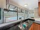 Kitchen sink with granite countertops overlooks the pool in the backyard at 876 Lobster Ct, Kissimmee, FL 34744
