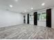 Large open living room with wood-look floors and neutral paint colors at 876 Lobster Ct, Kissimmee, FL 34744