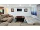 Spacious living room featuring comfortable seating and a stone fireplace at 876 Lobster Ct, Kissimmee, FL 34744