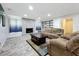 Comfortable living room with a stone fireplace and plush seating on light hardwood style floors at 876 Lobster Ct, Kissimmee, FL 34744