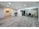 Open-concept living area with wood-look flooring, recessed lights and dining area at 876 Lobster Ct, Kissimmee, FL 34744