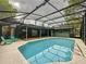 Beautiful, screened-in pool with seating area; great for entertaining outdoors at 876 Lobster Ct, Kissimmee, FL 34744