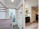 Modern tiled shower featuring glass door and stone tile flooring at 876 Lobster Ct, Kissimmee, FL 34744