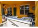 Outdoor bar area with tiled countertops and a functional sink at 917 Orange Cosmos Blvd, Davenport, FL 33837