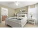 Comfortable bedroom with a ceiling fan, soft lighting, and a relaxing ambiance at 917 Orange Cosmos Blvd, Davenport, FL 33837