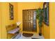 Inviting front entrance with decorative bench, potted plant and decorative art at 917 Orange Cosmos Blvd, Davenport, FL 33837