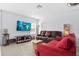 Inviting living room with neutral walls, comfy couches, TV, and stylish decor at 917 Orange Cosmos Blvd, Davenport, FL 33837