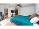 Bedroom with television, walk-in closet and ensuite bath at 9916 Jackson Rd, Leesburg, FL 34788