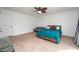 Relaxing bedroom featuring neutral tones, carpet flooring, and a comfortable queen-sized bed at 9916 Jackson Rd, Leesburg, FL 34788