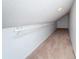 A walk-in closet with a sloped ceiling, neutral carpet, and a rod for hanging clothes at 9916 Jackson Rd, Leesburg, FL 34788