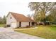Charming home with mature trees, an attached garage, a well-maintained lawn, and inviting curb appeal at 9916 Jackson Rd, Leesburg, FL 34788