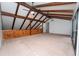 Spacious living room with vaulted ceilings, exposed beams, ceiling fans, and sliding glass doors at 9916 Jackson Rd, Leesburg, FL 34788