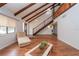 Bright living room showcasing wood floors and an open staircase at 9916 Jackson Rd, Leesburg, FL 34788