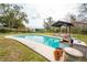 Refreshing pool and cozy cabana, perfect for outdoor enjoyment at 9916 Jackson Rd, Leesburg, FL 34788