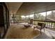 Relaxing covered porch with comfortable seating and a hammock at 9916 Jackson Rd, Leesburg, FL 34788
