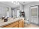 Bright bathroom with a large mirror and plenty of natural light at 10986 Ledgement Ln, Windermere, FL 34786
