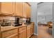 Convenient coffee bar area with cabinetry and countertop space at 10986 Ledgement Ln, Windermere, FL 34786