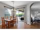 Bright dining room featuring a wooden table, chandelier, and sliding glass doors to the patio at 10986 Ledgement Ln, Windermere, FL 34786