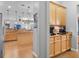 Elegant kitchen boasts wooden cabinetry and countertop space perfect for coffee preparation, blending style and functionality at 10986 Ledgement Ln, Windermere, FL 34786