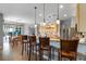 Spacious kitchen with breakfast bar seating, pendant lights, and stainless steel appliances at 10986 Ledgement Ln, Windermere, FL 34786