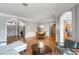 Open-concept living room featuring wood floors, neutral colors, and arched doorways at 10986 Ledgement Ln, Windermere, FL 34786