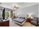 Spacious main bedroom with sliding door access to the outdoor patio at 10986 Ledgement Ln, Windermere, FL 34786
