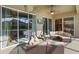 Relax on the covered patio with comfortable seating and a TV, perfect for enjoying the outdoors at 10986 Ledgement Ln, Windermere, FL 34786