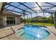 Sparkling pool with screened enclosure offers a private outdoor retreat, perfect for relaxation and entertainment at 10986 Ledgement Ln, Windermere, FL 34786