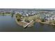 Gorgeous aerial view showcasing lakefront living and pedestrian bridge in the community at 13831 Briand Ave, Orlando, FL 32827