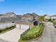 Aerial view of a home with a fenced yard, screened-in patio, and a two-car garage at 13831 Briand Ave, Orlando, FL 32827