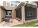 Exterior view of the screened-in patio and brick paved seating area at 13831 Briand Ave, Orlando, FL 32827