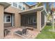 Exterior view of the screened-in patio and brick paved seating area at 13831 Briand Ave, Orlando, FL 32827