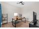 This room has hardwood floors, a large desk, shelving, a ceiling fan, and plenty of space at 13831 Briand Ave, Orlando, FL 32827