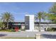 Exterior view of a modern building with a sign that reads 'Canvas Restaurant & Market' and landscaped surroundings at 13831 Briand Ave, Orlando, FL 32827