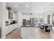 The kitchen features a spacious island, stainless appliances, and a dining area at 13831 Briand Ave, Orlando, FL 32827