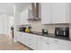 Bright kitchen boasts granite countertops, white cabinetry, and stainless steel appliances at 13831 Briand Ave, Orlando, FL 32827