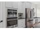 Stainless steel oven and microwave, with stainless steel fridge and granite countertops at 13831 Briand Ave, Orlando, FL 32827