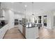 Bright, modern kitchen with island, stainless appliances, and eat-in dining area at 13831 Briand Ave, Orlando, FL 32827