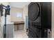 The laundry room showcases a large washer, dryer, and plenty of storage at 13831 Briand Ave, Orlando, FL 32827