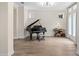 Elegant living room featuring a grand piano and sophisticated decor at 13831 Briand Ave, Orlando, FL 32827