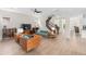 A spacious living room with tile floors, wood accents, and plenty of natural light at 13831 Briand Ave, Orlando, FL 32827