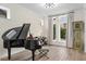 Refined living area showcasing a piano and decorative clock at 13831 Briand Ave, Orlando, FL 32827