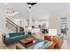 A spacious living room connecting to the kitchen and dining area, perfect for entertaining at 13831 Briand Ave, Orlando, FL 32827