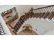 Overhead view of hardwood staircase with metal balusters and tiled landing at 13831 Briand Ave, Orlando, FL 32827