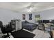 Relaxing bedroom featuring tile floors, ceiling fan, and a comfortable sleeping area at 139 Acapulco Dr, Kissimmee, FL 34743