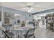 Dining area with tile floors, view to kitchen, and view to the living room at 139 Acapulco Dr, Kissimmee, FL 34743