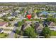 Overhead view of the home, nestled in a community with mature trees and well-maintained landscaping at 1502 Fern Bay Ct, Orlando, FL 32824