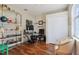 Bedroom featuring hardwood floors, a desk, an office chair and closet at 1502 Fern Bay Ct, Orlando, FL 32824