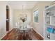 Elegant dining room with a mirrored table, chandelier, and stylish decor at 1502 Fern Bay Ct, Orlando, FL 32824