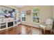 Inviting living room featuring hardwood floors, arched windows, and a fireplace at 1502 Fern Bay Ct, Orlando, FL 32824